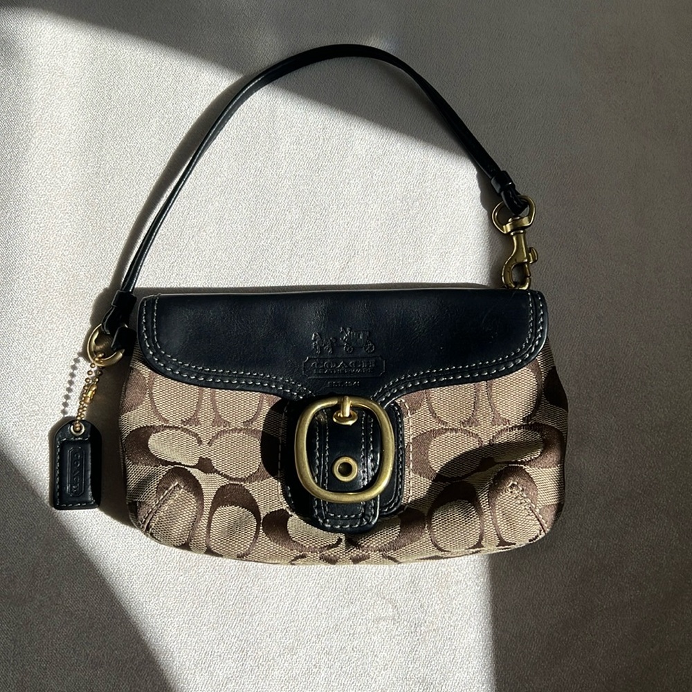 Coach small clutch/wristlet in signature C with black leather trim.